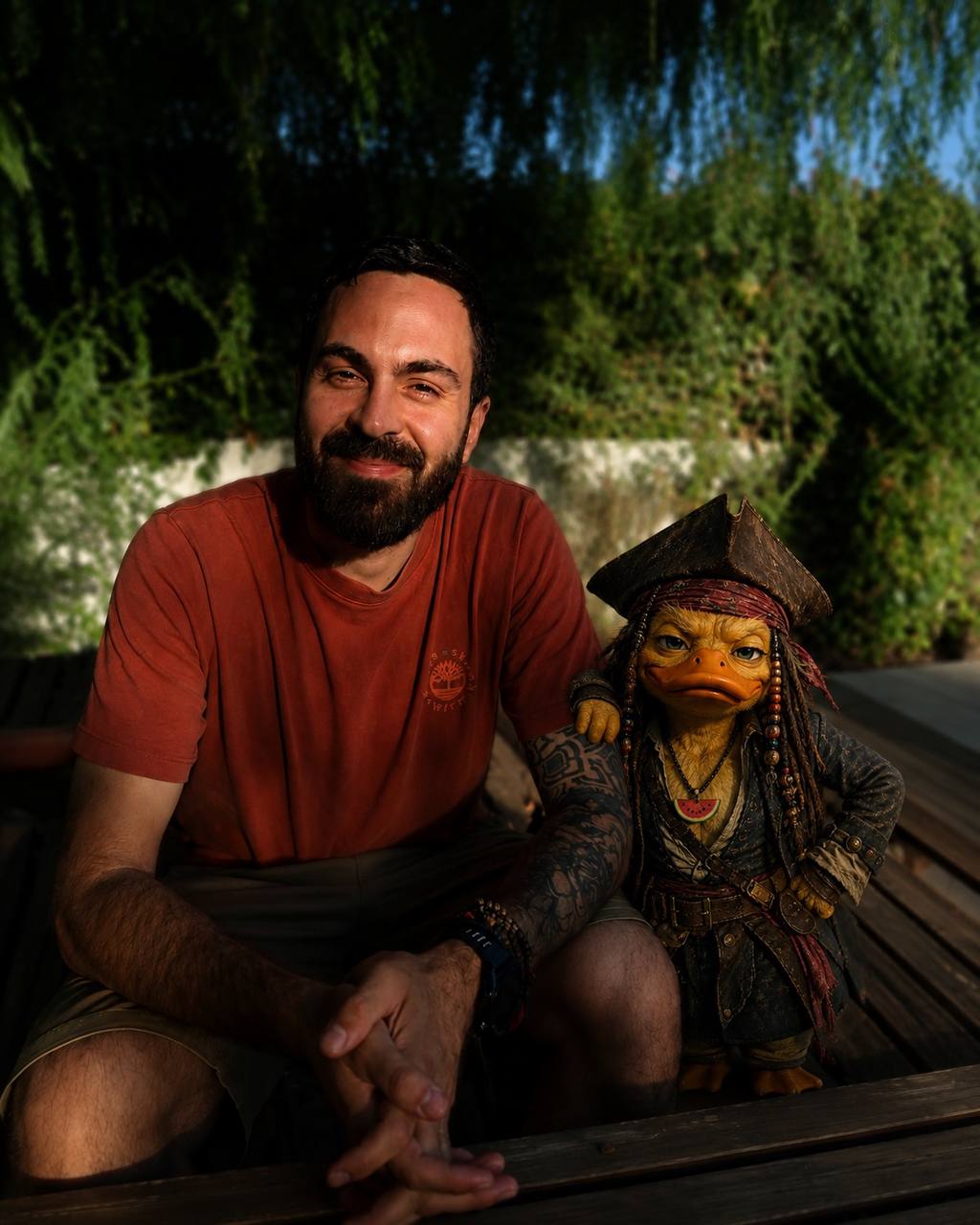 Jacob Pegs sitting on a deck next to Ducky